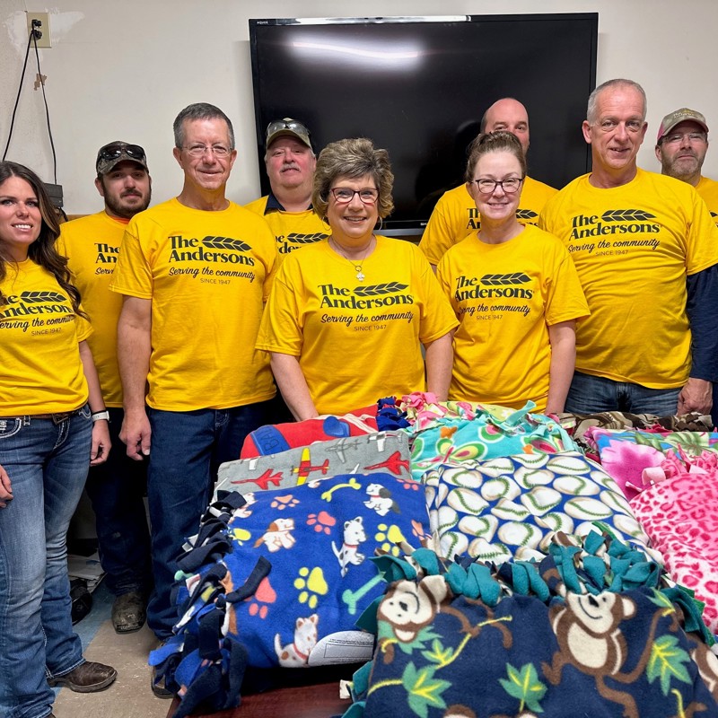 Group of employees with handmade fleece blankets 